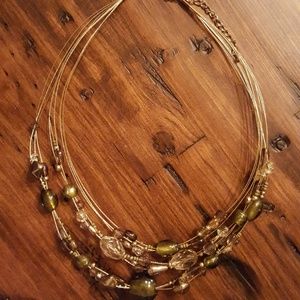 Green bead and gold layered necklace.